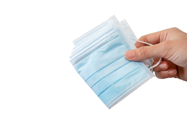 手持一次性耳环面罩，保护冠状病毒或新冠肺炎。图片下载
