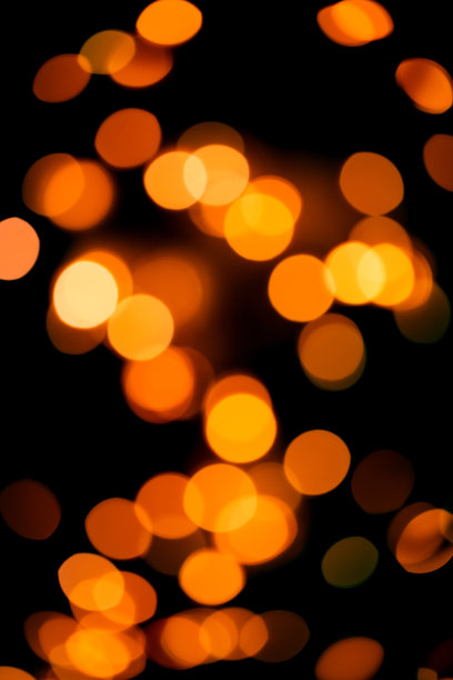黑色背景，明亮温暖的散景灯光。假日、圣诞节和新年的背景。理想的层与任何设计图片下载