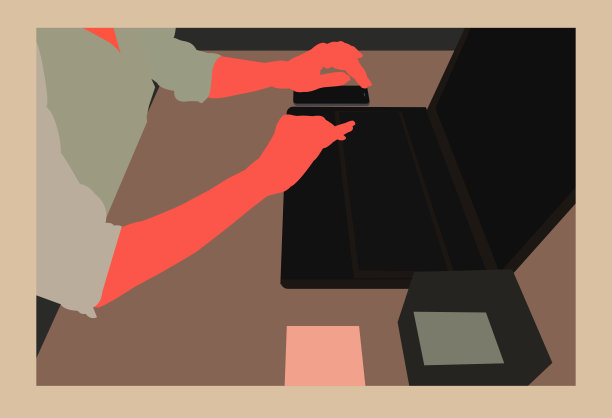 在工作场所使用笔记本电脑的商务人士。素材图片