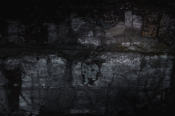 深色烧焦的木制背景。壁纸图片下载