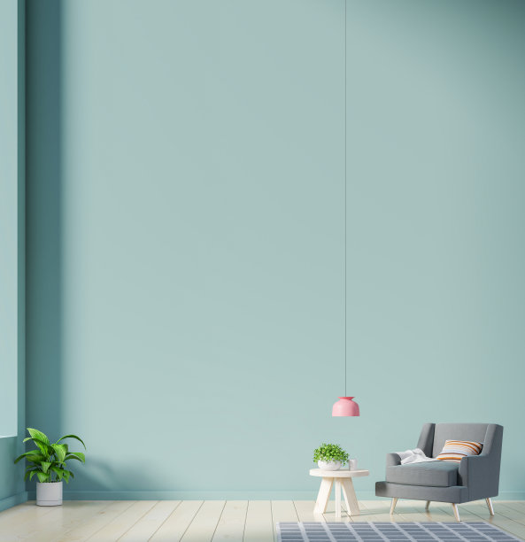 室内有一把扶手椅，背景是空的绿色墙壁。图片下载