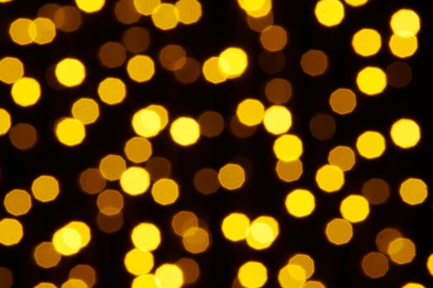 抽象背景-黄色散景在黑色上的照片图片下载