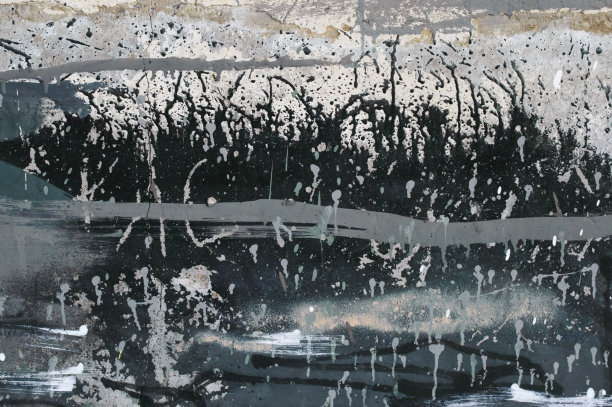 旧混凝土背景，有裂缝和油漆飞溅。照片的背景。图片下载