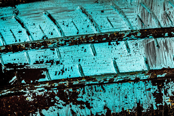 墙上有油漆污渍。涂鸦墙。混凝土墙上的彩绘。汽车轮胎纹理。图片下载