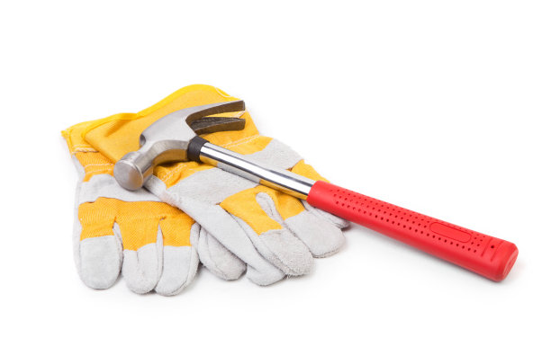 施工手套和锤子。图片下载