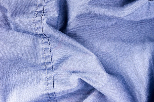 衣服项目石洗棉织物纹理接缝，扣，钮扣和铆钉，宏观图片下载