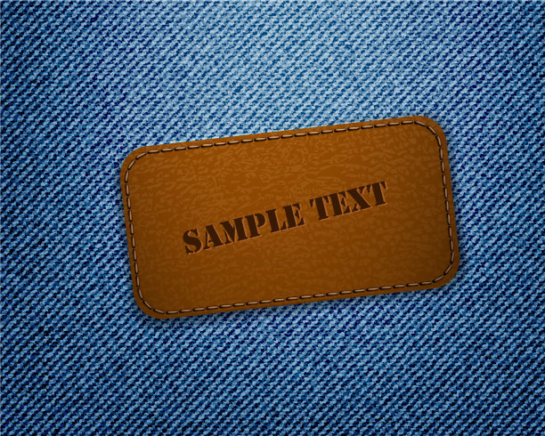 牛仔裤背景上的皮革标签图片下载