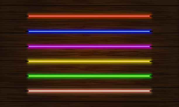 一组霓虹灯刷。一组彩色灯光物体在一个黑暗的树背景。图片下载