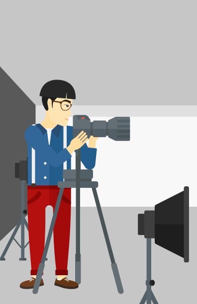 摄影师与相机在三脚架上工作图片下载