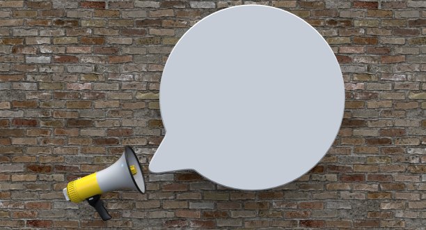 单黄色电扩音器在砖背景图片下载