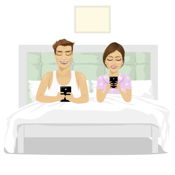 年轻夫妇在床上用他们的智能手机图片下载