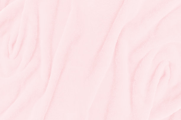 柔软的粉红色织物纹理背景。抽象的布料丝绸墙纸或背景图片下载