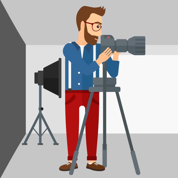 摄影师与相机在三脚架上工作图片下载