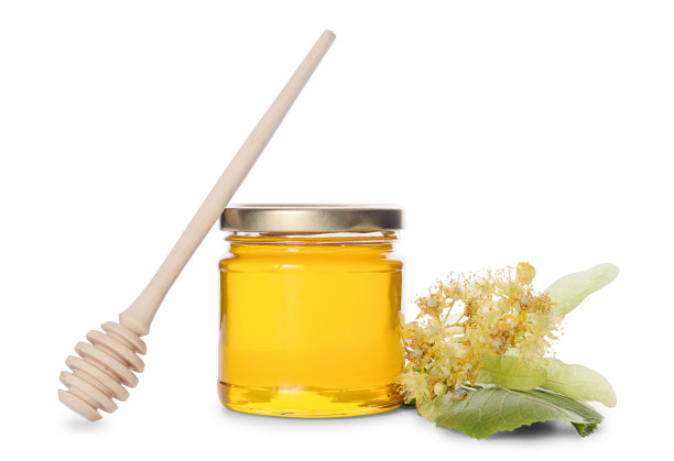 瓶菩提树蜂蜜，蜂蜜勺和开花的菩提树在白色图片下载