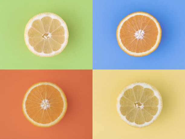 橙色和柠檬片配上彩色的背景图片下载
