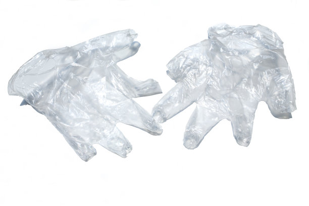 白色背景的一次性塑料防护手套，特写，covid - 19预防，冠状病毒，细菌，医疗保健图片下载