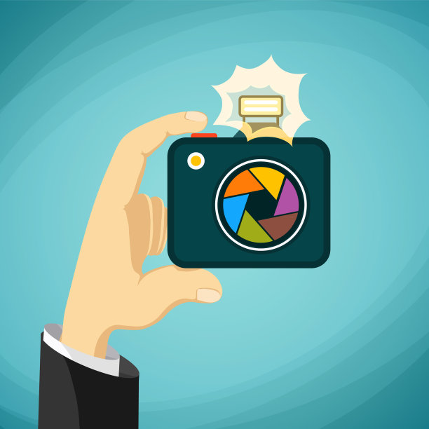 一名男子手里拿着一架照相机图片下载