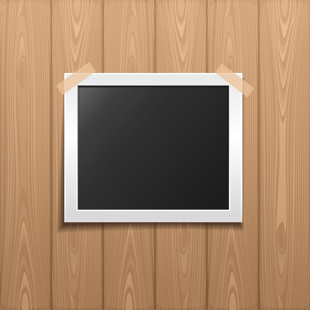 放在木制背景上的相框图片下载