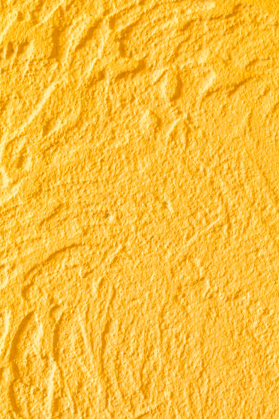 黄色的混凝土墙面纹理。设计以豪华为背景，以建筑为主题，以装饰为主题。手工制作的。图片下载