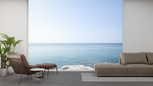 现代住宅或豪华酒店大客厅混凝土地板上的沙发。图片下载