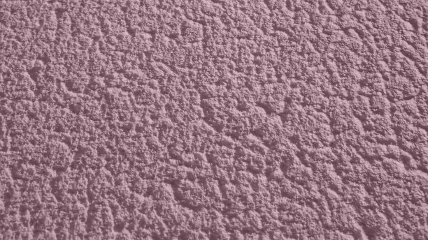 粉红色的纹理。墙上有纹理的灰泥图片下载