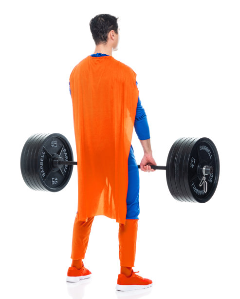 白种年轻男性英雄在白色背景下穿着服装，积极地进行重量训练图片下载