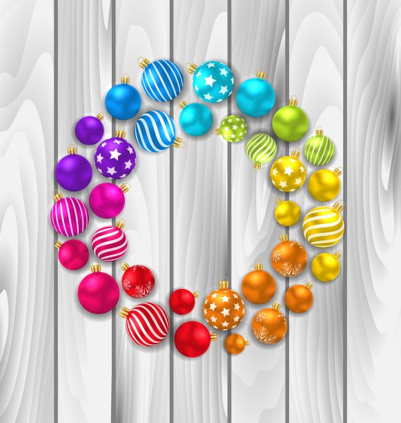 把彩色的圣诞玻璃球放在木头上图片下载