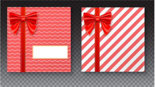 礼盒上有红色的大蝴蝶结和丝带图片下载