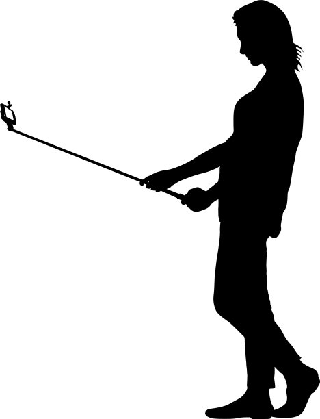 女性用智能手机自拍的剪影图片下载