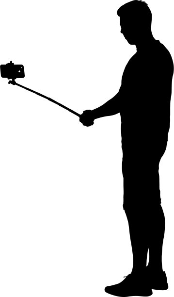 剪影男子自拍智能手机图片下载