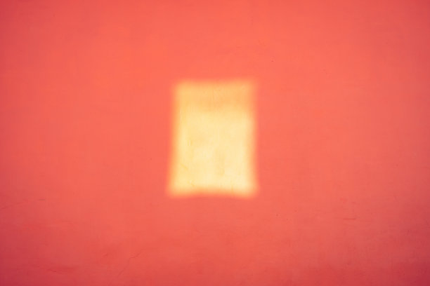 特写橙色墙壁纹理与阳光阴影图片下载