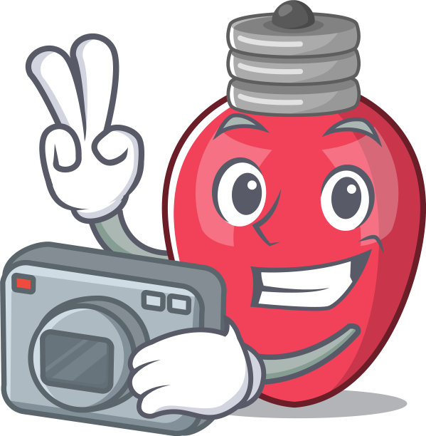 摄影师在吉祥物桌上的圣诞灯图片下载