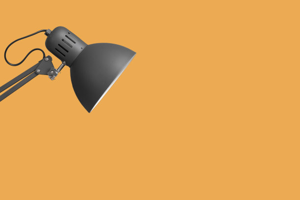 橙色背景上的工作灯图片下载