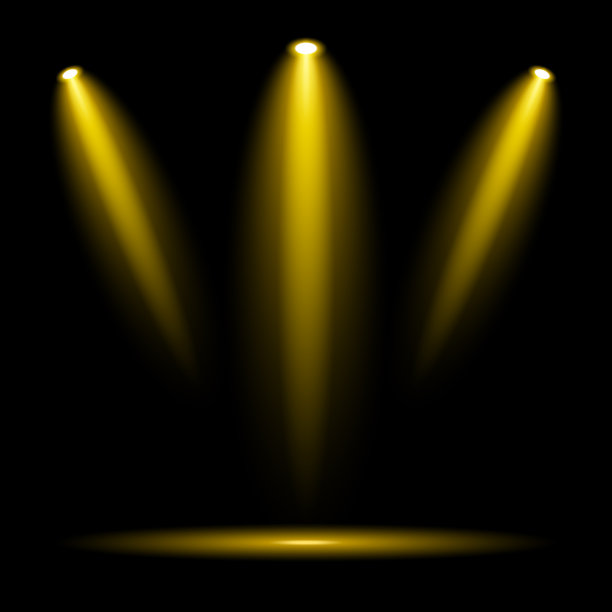 金色的聚光灯在黑暗的背景上图片下载