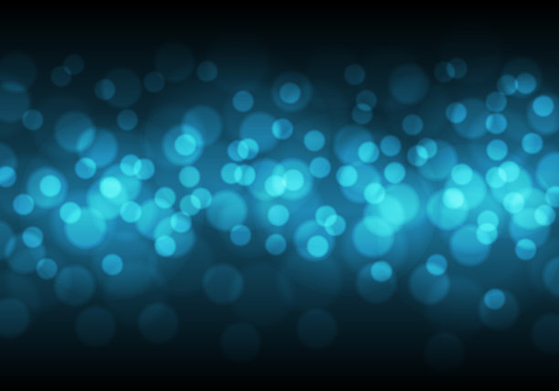 抽象的蓝色散景光在黑色的夜晚图片下载