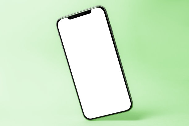 智能手机模型，手机空白屏幕和阴影隔离在绿色背景。象征轻盈、清新、清新。复制空间，现代技术，社交网络和应用图片下载