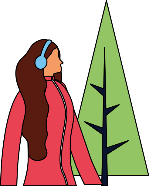 戴着耳机的女人，冬天的衣服和树图片下载