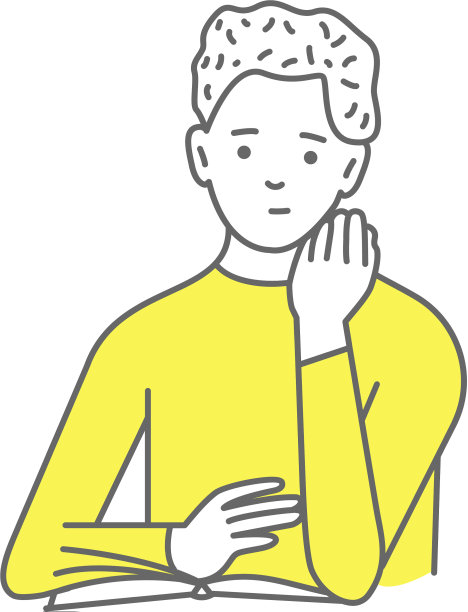 一个年轻人在读一本平面设计的书图片下载