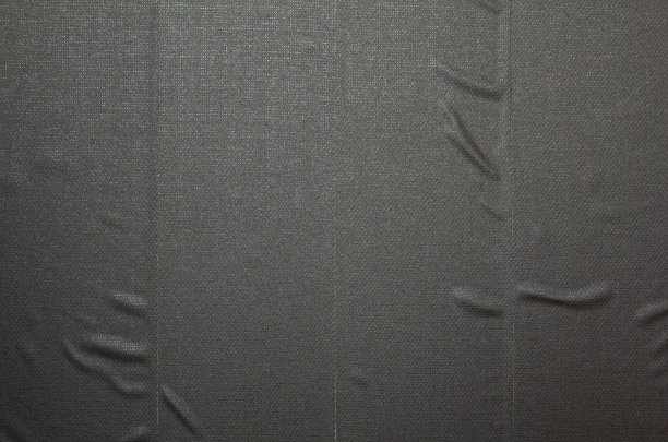 宽垂直条纹的黑色纺织胶带与粗糙的波浪表面纹理背景。文本信息的复制空间。图片下载