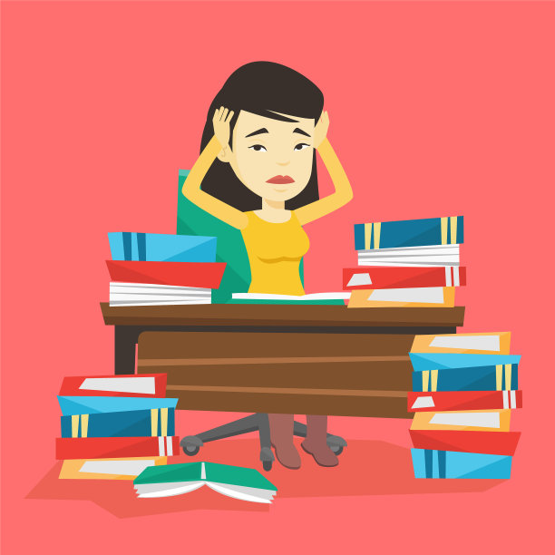 学生坐在桌子旁，手里拿着成堆的书图片下载