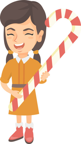 一个白人小女孩拿着圣诞拐杖糖图片下载