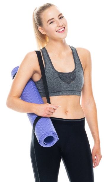 白人年轻女性准备在白色的背景下穿着瑜伽裤和使用练习垫瑜伽图片下载