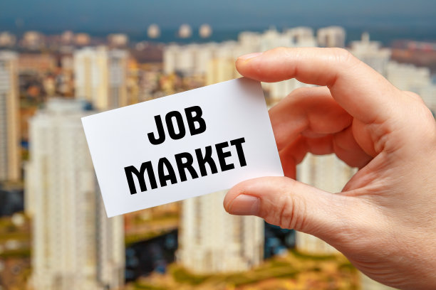 JOB MARKET—一个人持有的卡片上的题词图片下载