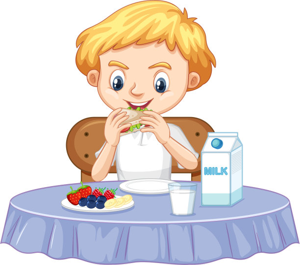 一个快乐的男孩吃着早餐图片下载