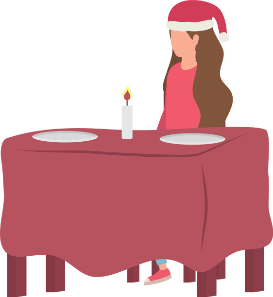 戴着圣诞帽的年轻女子坐在餐桌上图片下载