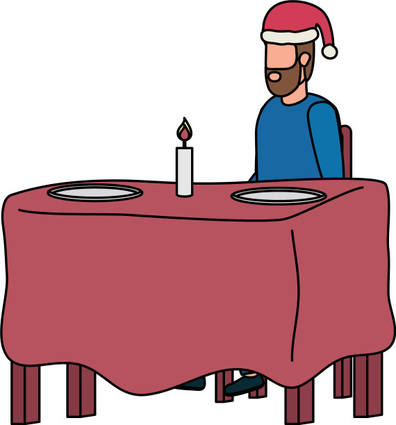 餐桌上戴着圣诞帽的年轻人图片下载