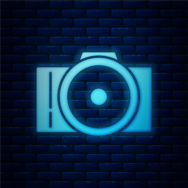 发光的霓虹灯照片相机图标孤立在砖块上图片下载