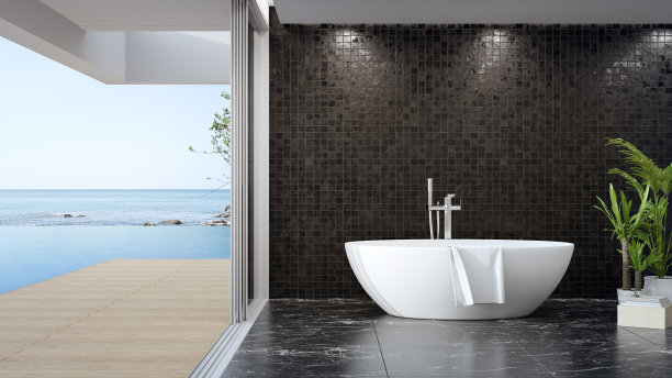 在现代住宅或豪华游泳池别墅的大浴室的黑色大理石地板上浴缸。图片下载