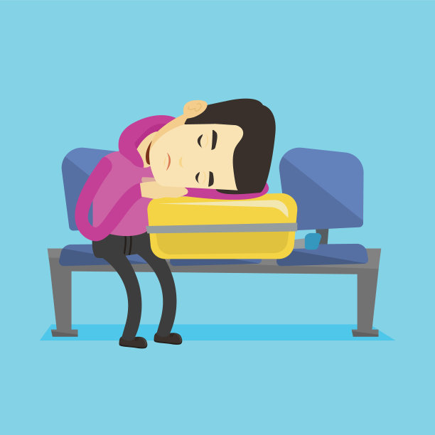 疲惫的男子睡在机场的行李箱上图片下载