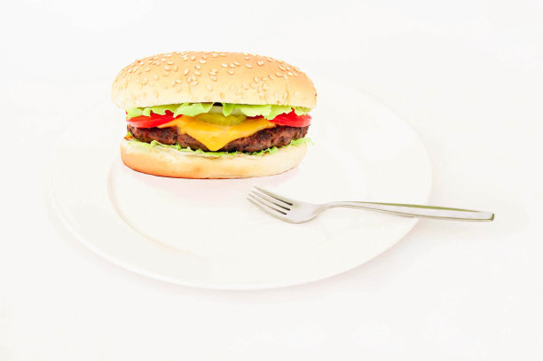汉堡放在白色的盘子和叉子上，选择性的集中图片下载